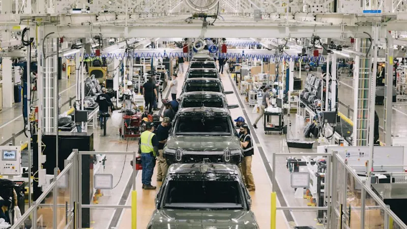 A photograph of the Rivian factory producing the company&#39;s R1 SUV variant.